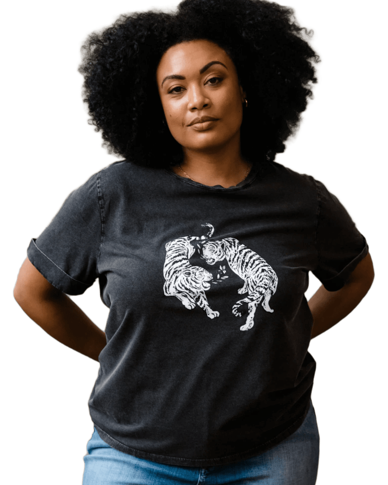 Front of a model wearing a size 1X Gloria Graphic Tee in Washed Black by ABLE. | dia_product_style_image_id:310243
